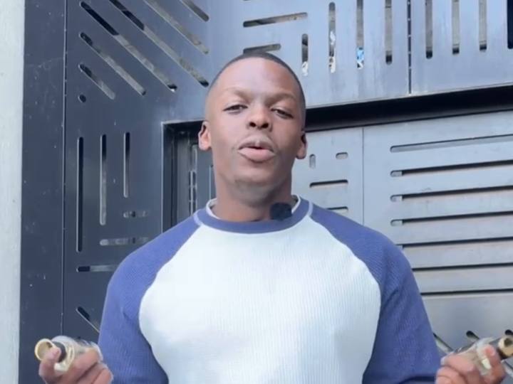 Scentimental creator holding two bottles