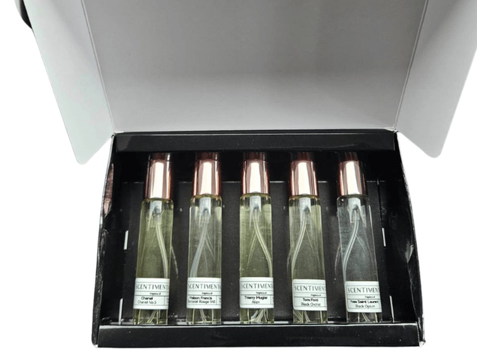 An open Scentimental discovery box holding five 15ml bottles