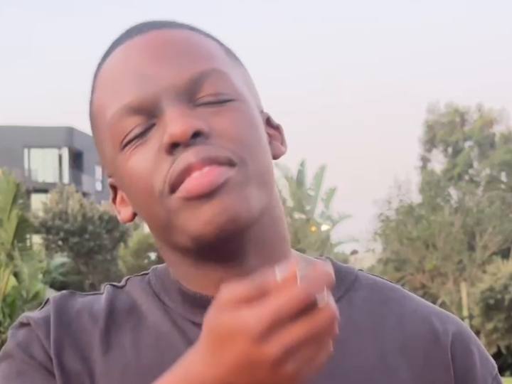 Scentimental creator applying fragrance to his neck